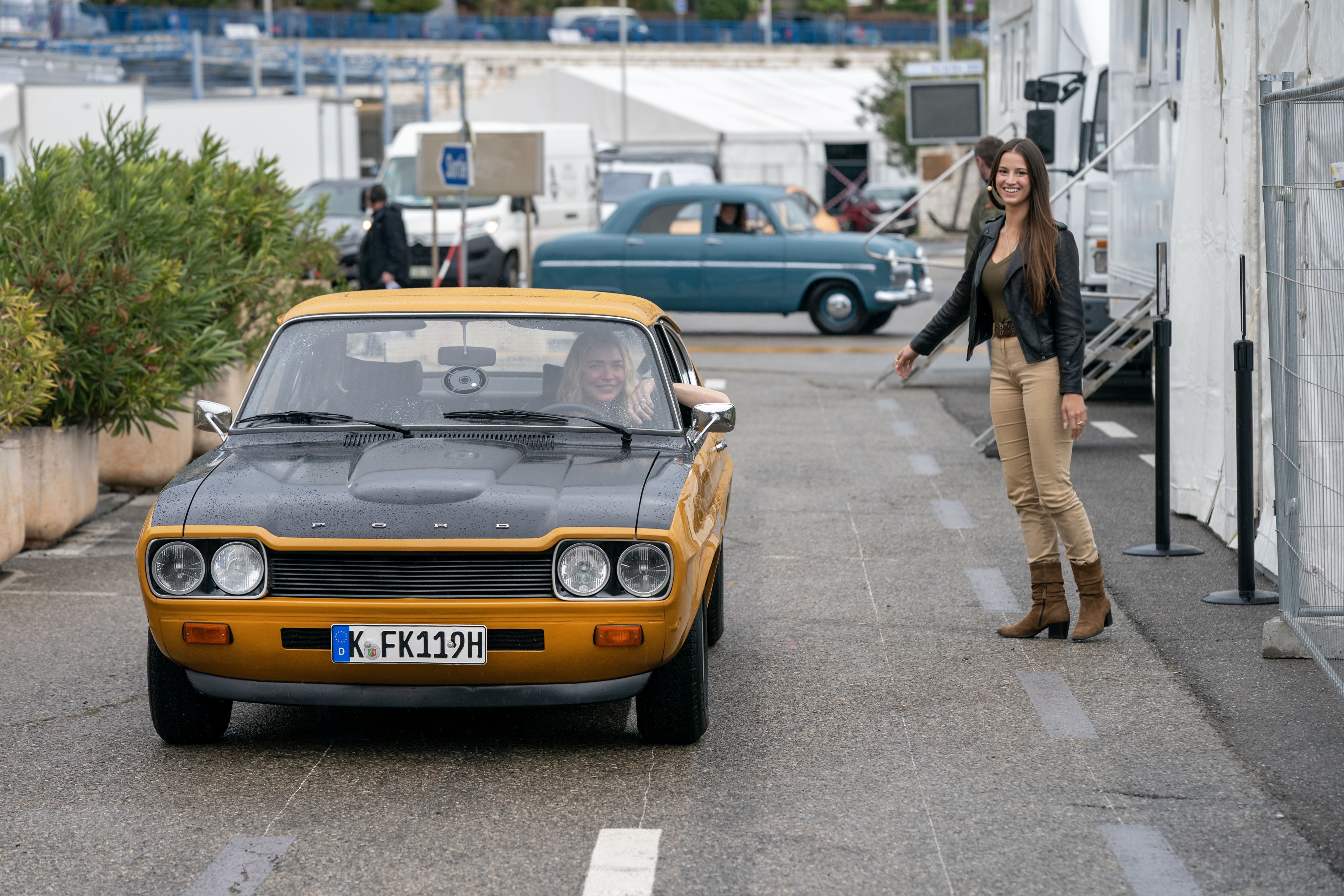 Lexie welcomes a classic Capri at the finale in Nice. LICENSE EXPIRES: PERPETUAL - LICENSE BY: Ford Europe LICENSE SCOPE: A - Earned editorial, press releases, press kits. B - All non-broadcast digital and online media. C - All non-broadcast digital and online media, plus Retail and POS (showrooms, events etc). D - All print media (newspaper, magazine etc) REGION: Global COPYRIGHT AND IMAGE RIGHTS: This content is solely for editorial use and for providing individual users with information. Any storage in databases, or any distribution to third parties within the scope of commercial use, or for commercial use is permitted with written consent from Ford of Europe only.