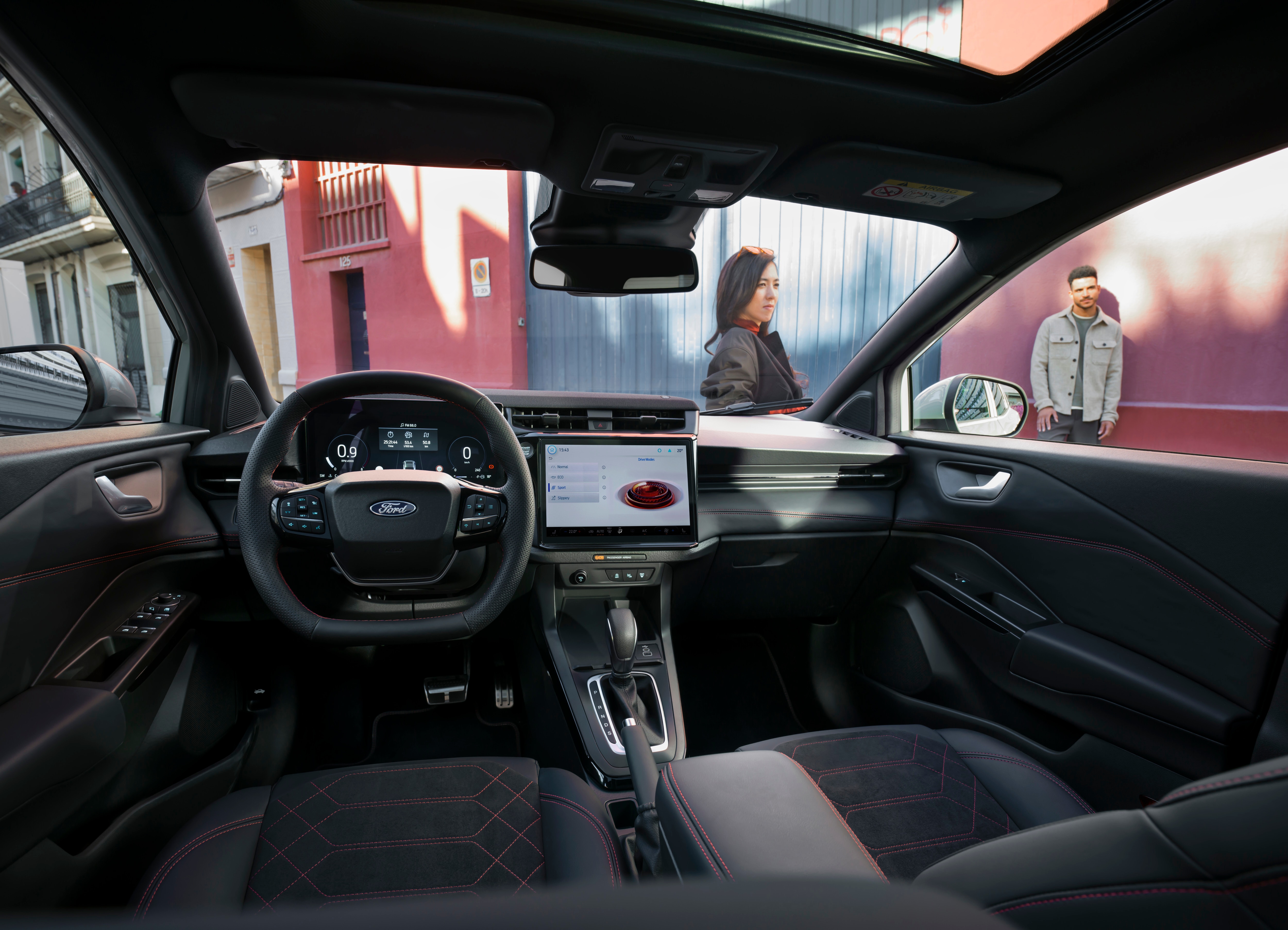 interior dashboard of car in busy street