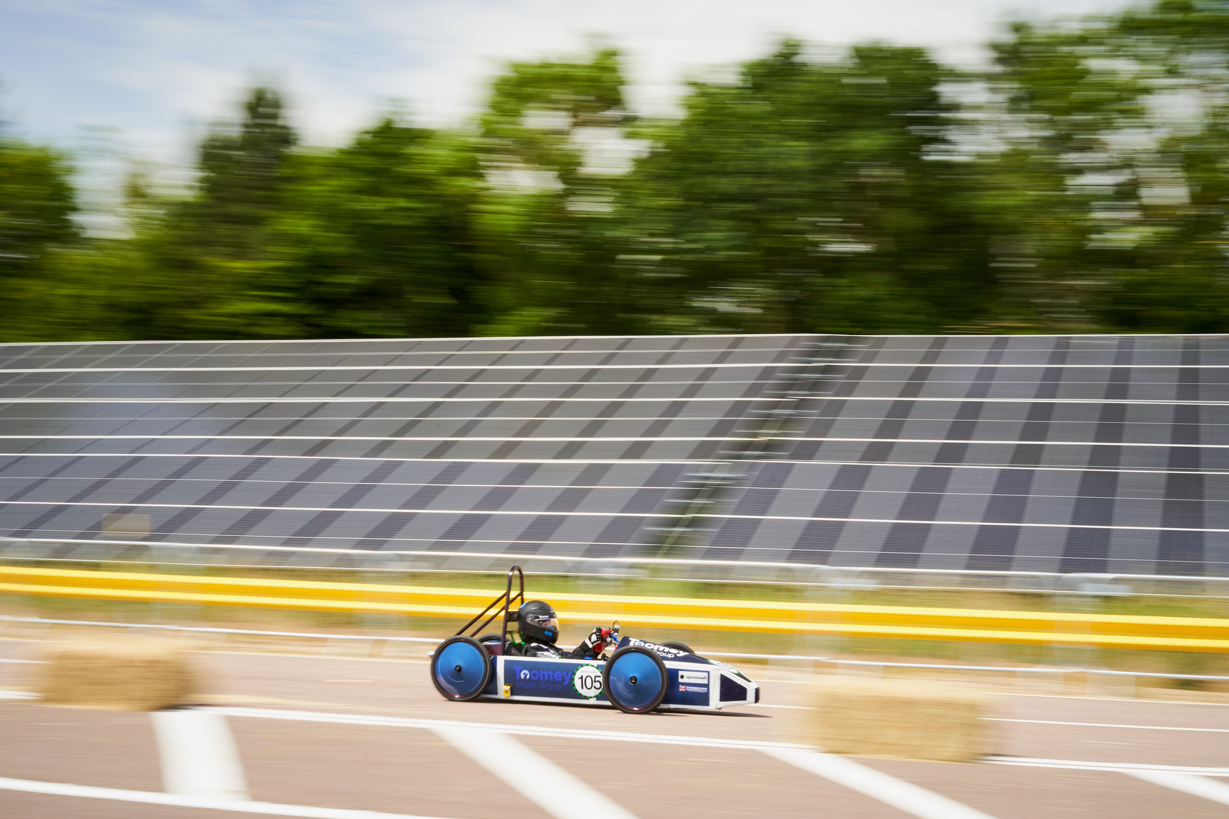 Speeding past Dunton's new solar panel array. LICENSE EXPIRES: PERPETUAL - LICENSE BY: Spacesuit Media LICENSE SCOPE: A - Earned editorial, press releases, press kits. B - All non-broadcast digital and online media. C - All non-broadcast digital and online media, plus Retail and POS (showrooms, events etc). D - All print media (newspaper, magazine etc) REGION: Global COPYRIGHT AND IMAGE RIGHTS: This content is solely for editorial use and for providing individual users with information. Any storage in databases, or any distribution to third parties within the scope of commercial use, or for commercial use is permitted with written consent from Ford of Europe only. IMAGE CREDIT: James Lynch / Spacesuit Media