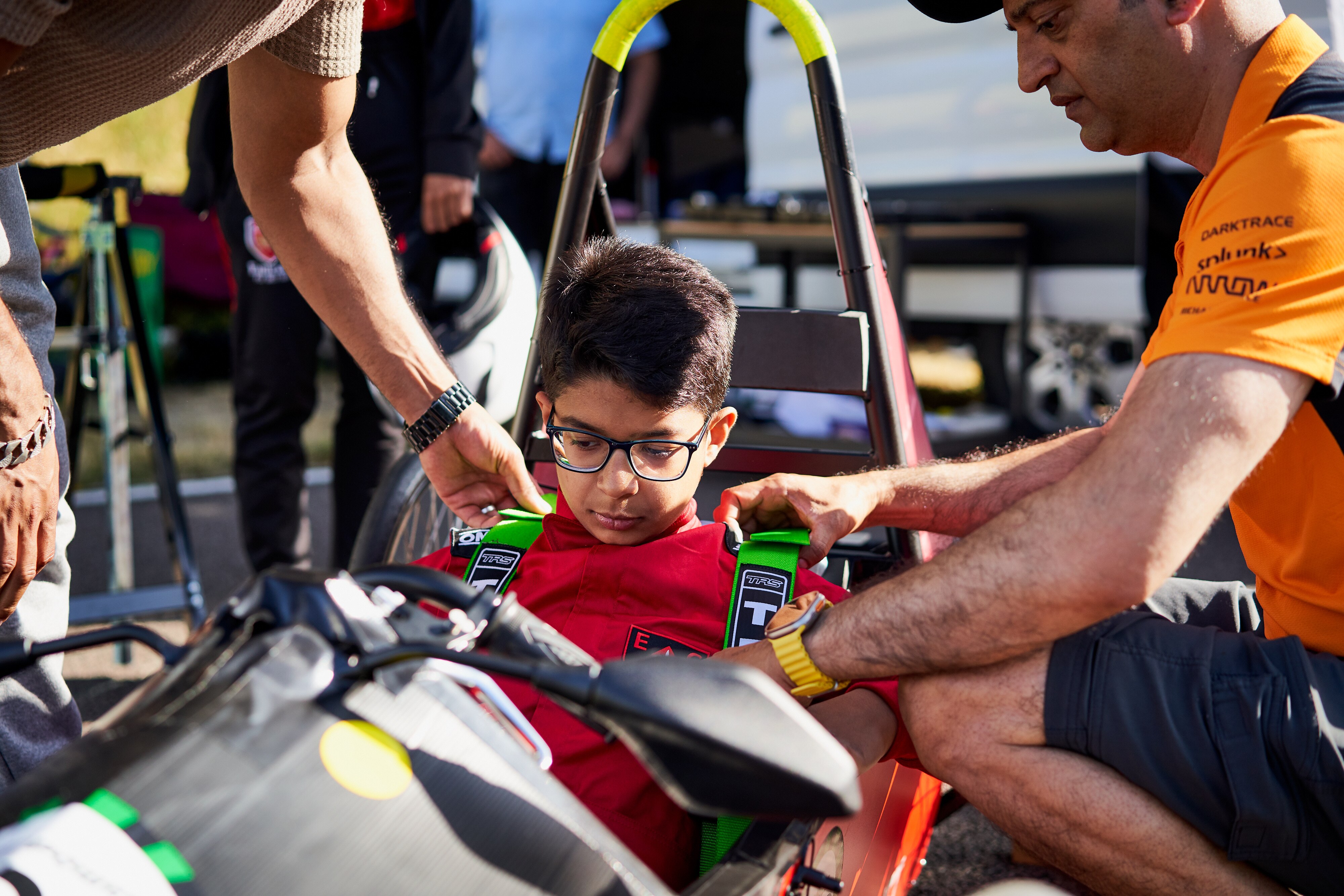 Young driver getting strapped in ready for the challenge ahead. LICENSE EXPIRES: PERPETUAL - LICENSE BY: Spacesuit Media LICENSE SCOPE: A - Earned editorial, press releases, press kits. B - All non-broadcast digital and online media. C - All non-broadcast digital and online media, plus Retail and POS (showrooms, events etc). D - All print media (newspaper, magazine etc) REGION: Global COPYRIGHT AND IMAGE RIGHTS: This content is solely for editorial use and for providing individual users with information. Any storage in databases, or any distribution to third parties within the scope of commercial use, or for commercial use is permitted with written consent from Ford of Europe only. IMAGE CREDIT: James Lynch / Spacesuit Media