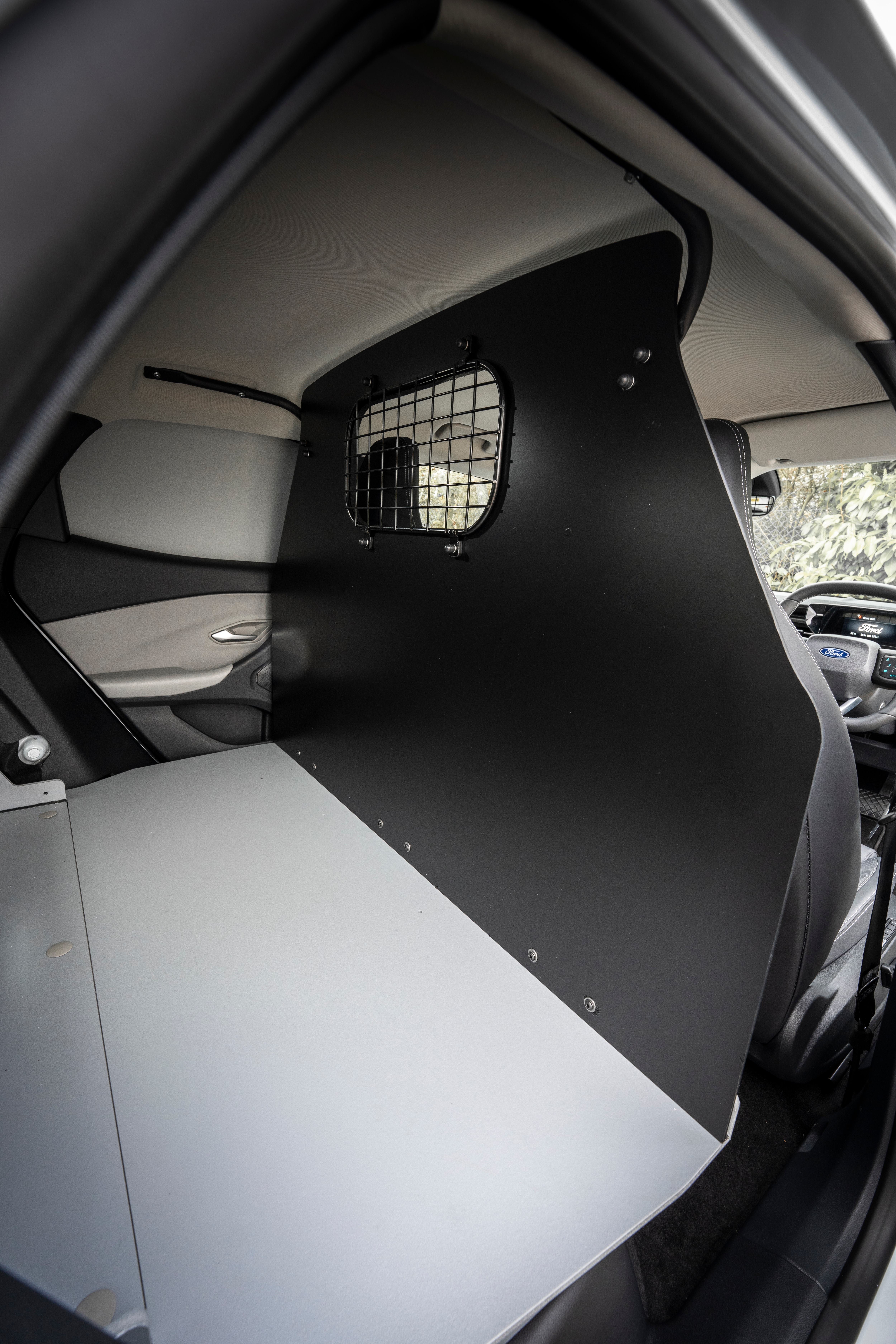 Explorer Van copolymer bulkhead separating seats and load area