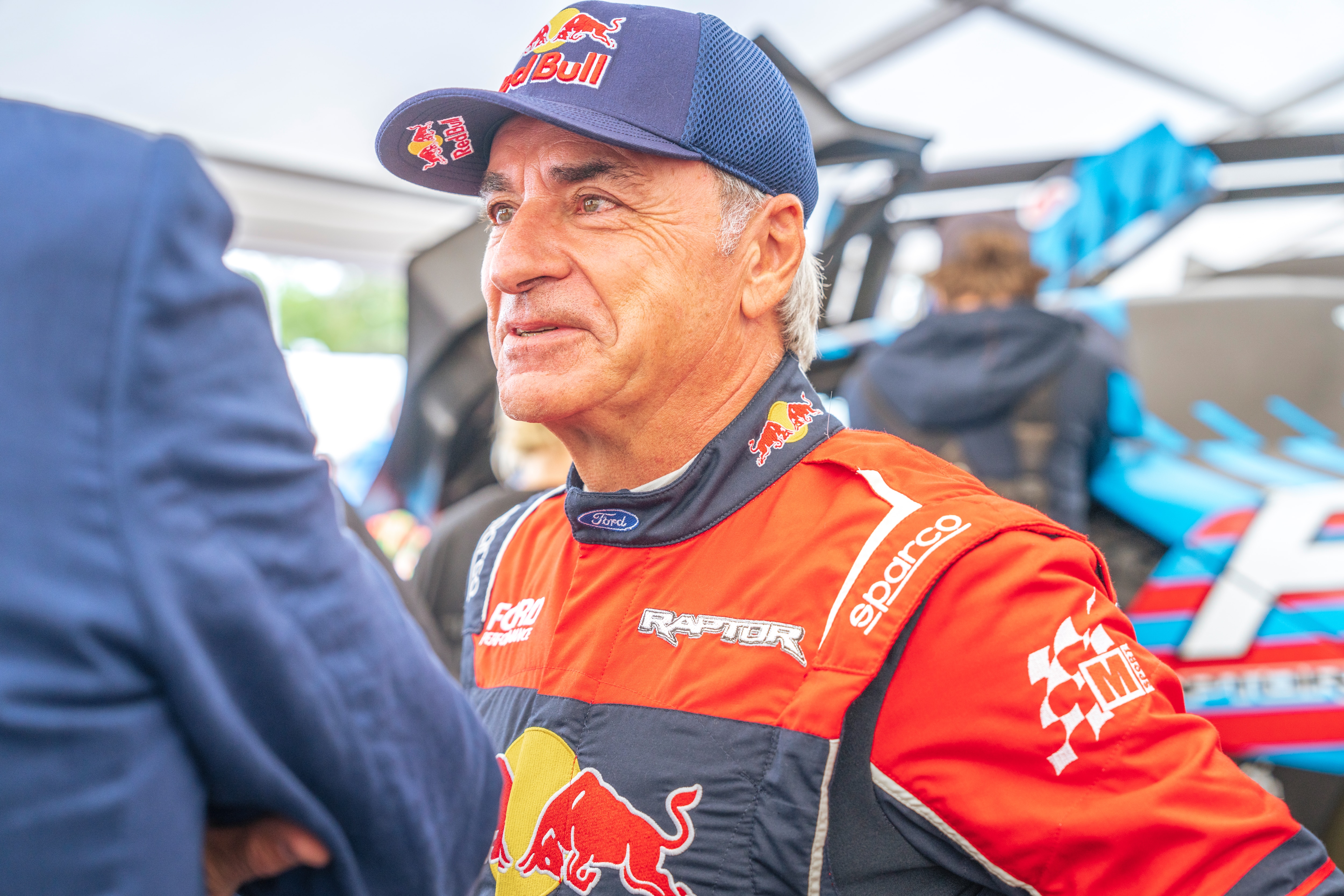 Rally legend Carlos Sainz at the 2024 Goodwood Festival of Speed. License valid for earned editorial, press releases, press kits. All non-broadcast digital and online media Region: Global. This content is solely for editorial use and for providing individual users with information. Any storage in databases, or any distribution to third parties within the scope of commercial use, or for commercial use is permitted with written consent from Ford in Europe GmbH only.
