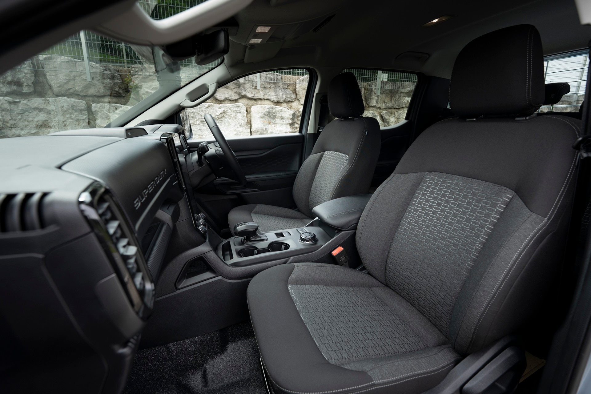 Interior of Ranger Super Duty parked by granite blocks
