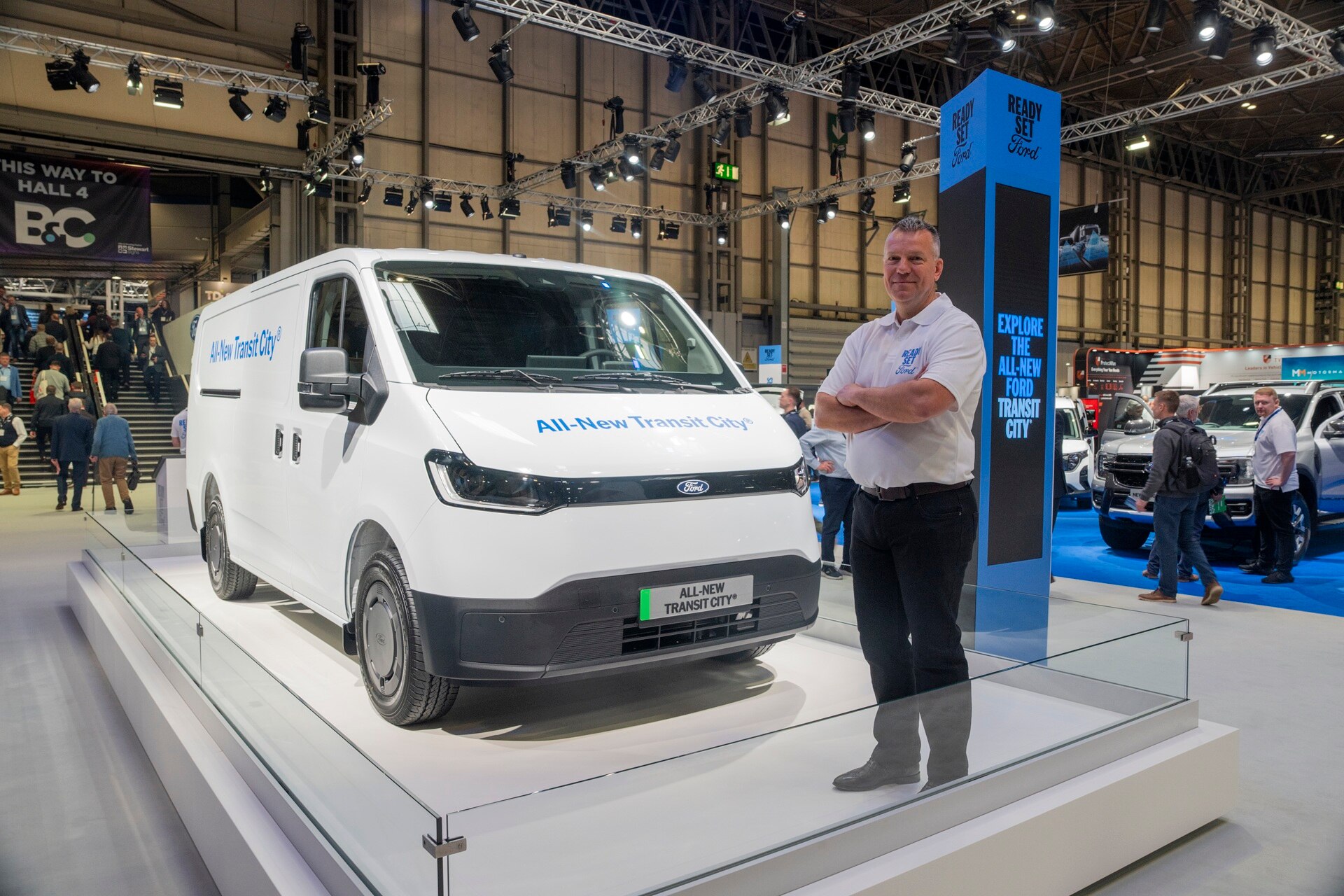 Simon Robinson stood next to Transit City on the Ford Pro stand