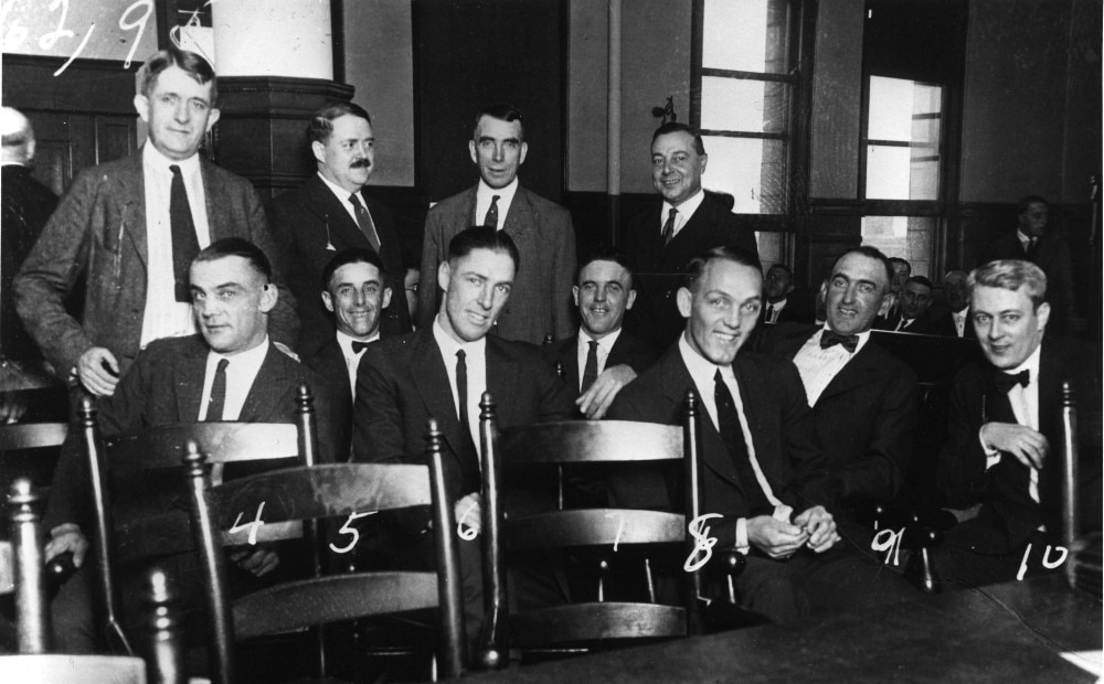 The Chicago White Sox players known as the "Black Sox" with their lawyers during the 1921 trial. Seated from left: Chick Gandil, Lefty Williams, Swede Risberg, Eddie Cicotte, Buck Weaver, and Shoeless Joe Jackson.