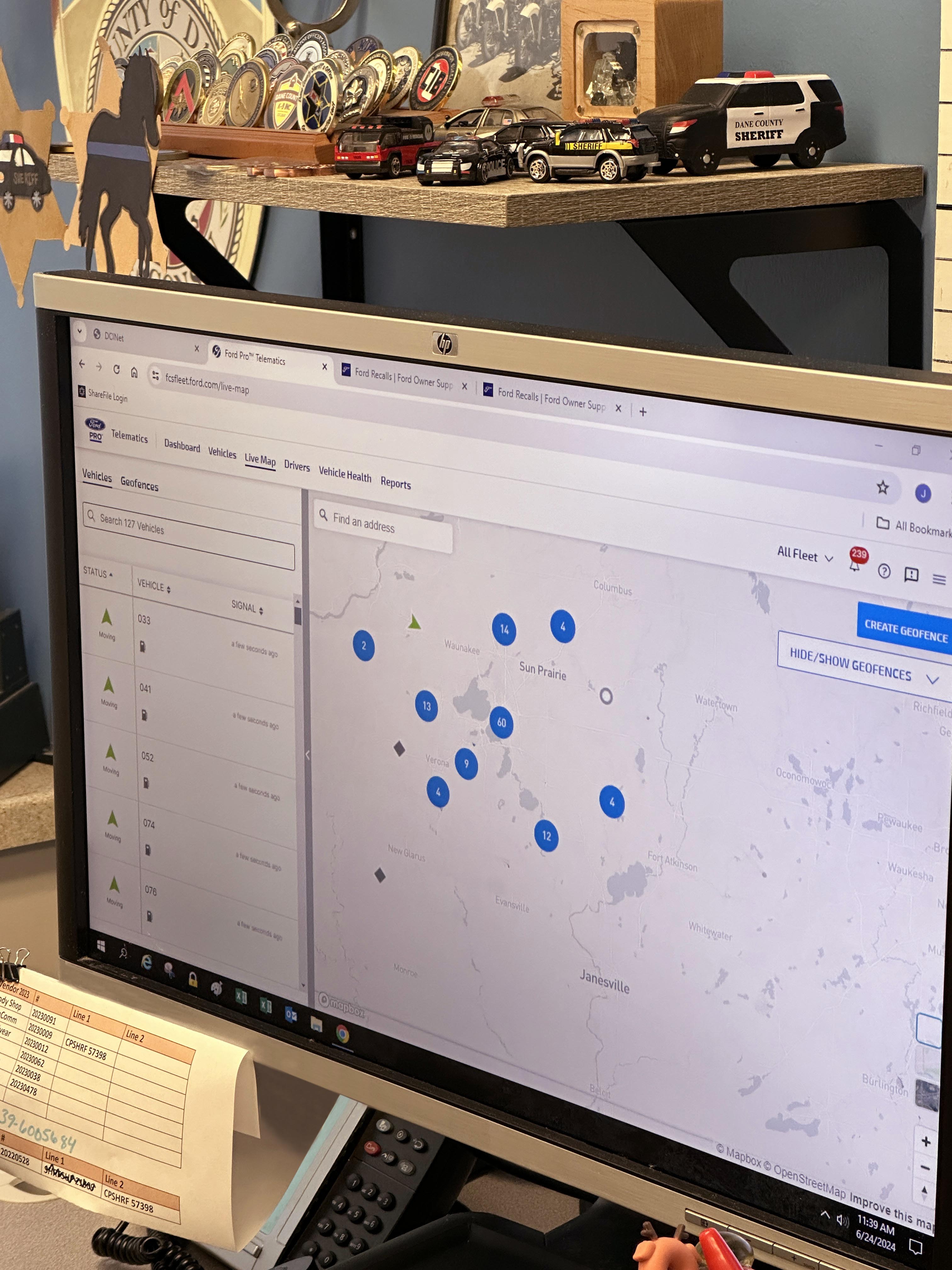 Desktop monitor with Ford Pro Telematics data collection site open.