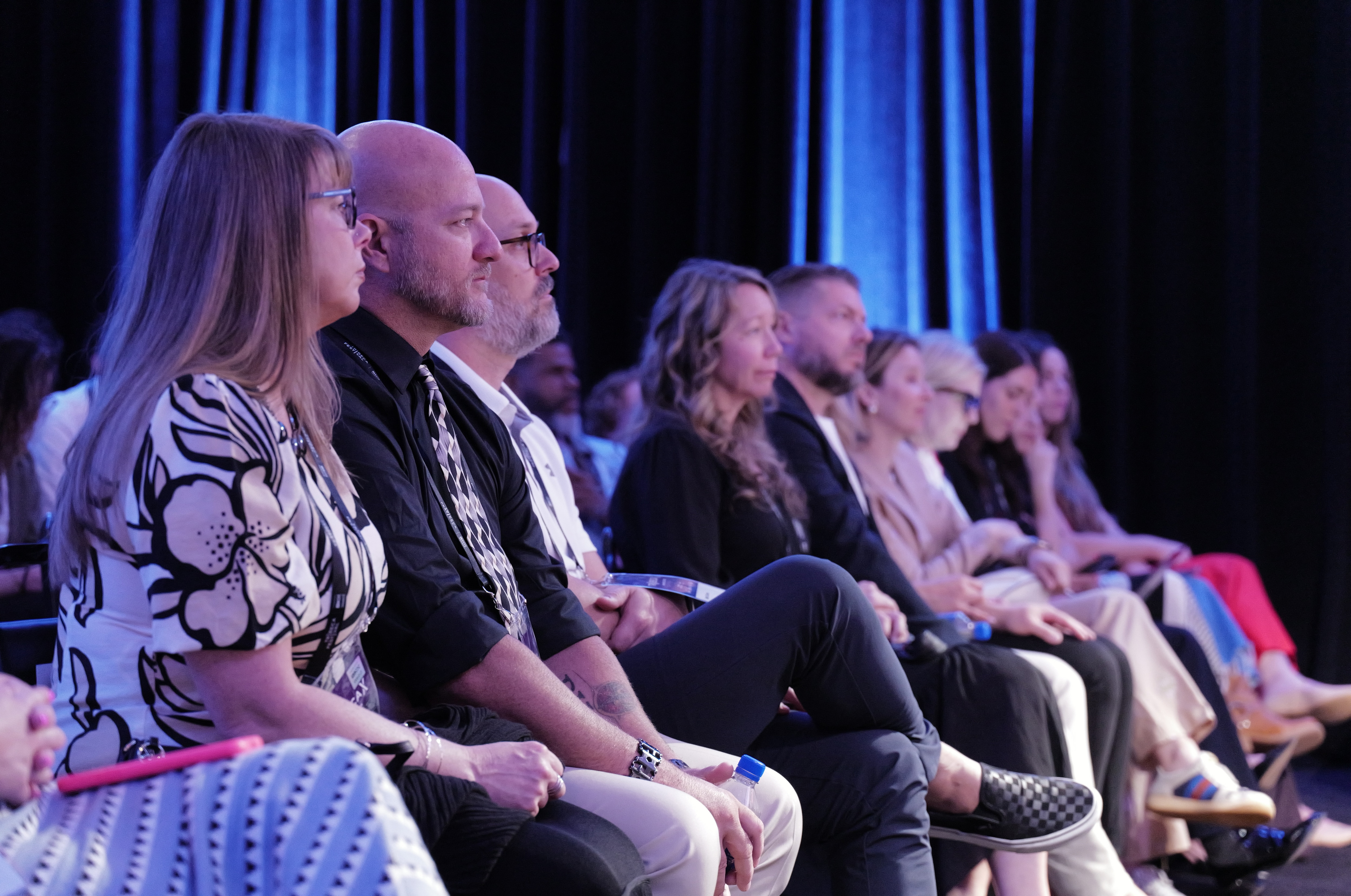 Former combat engineer Dan Wagner sits on stage at the premier of the documentary Call to Serve, a short film from Team Rubicon about his volunteer work. 