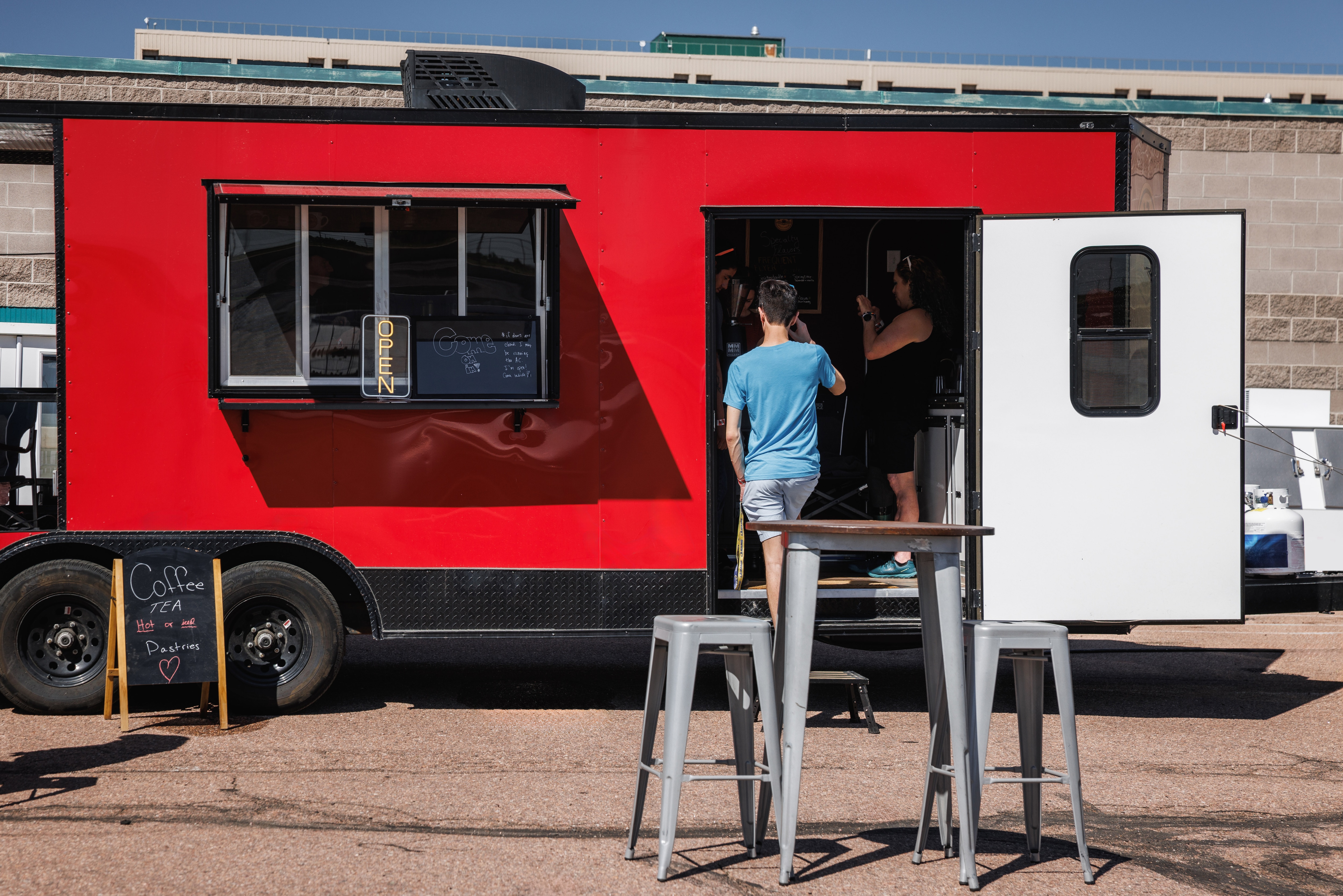 A line forming outside of Eliza's Lattes and Literature trailer.