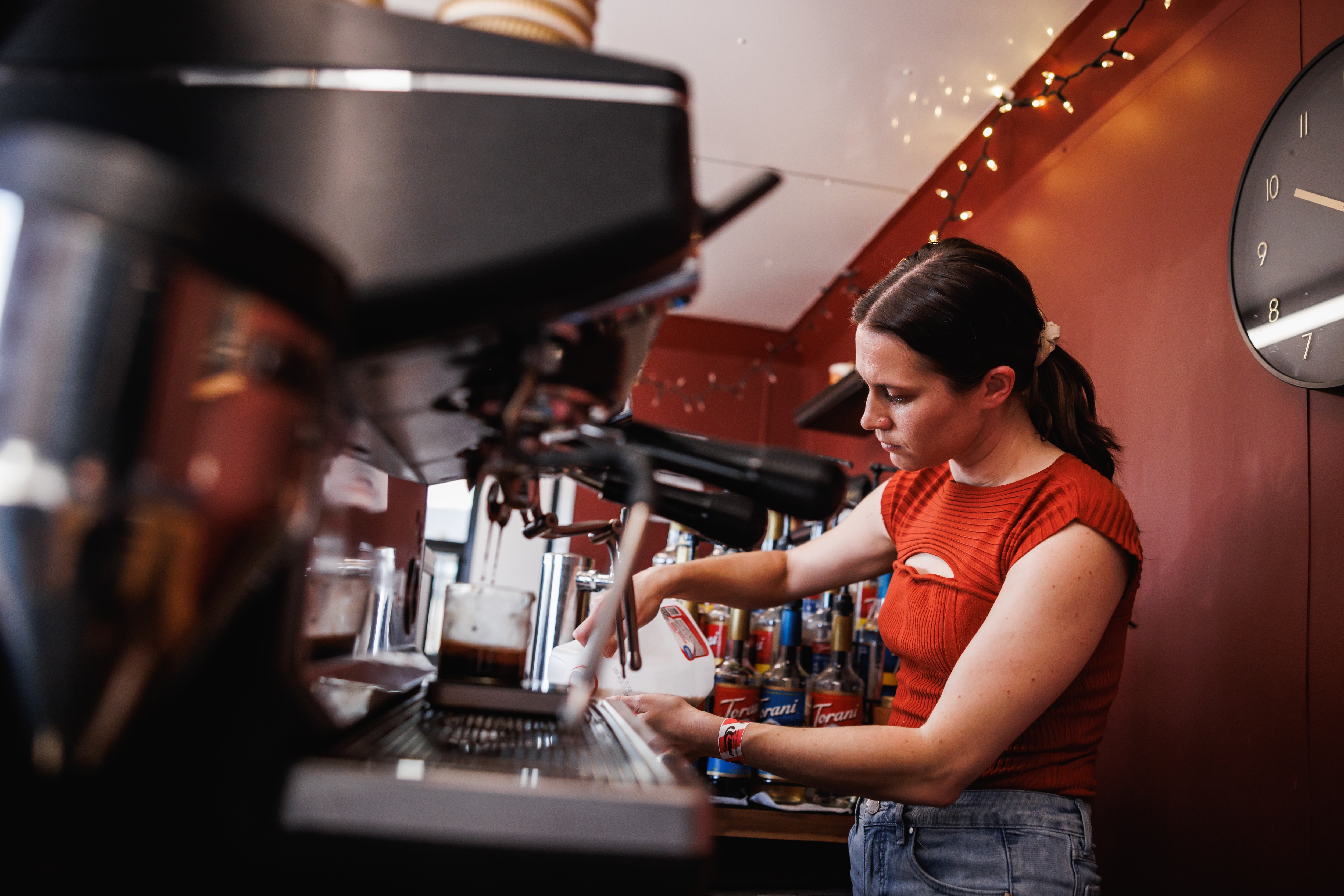 Eliza making a drink.
