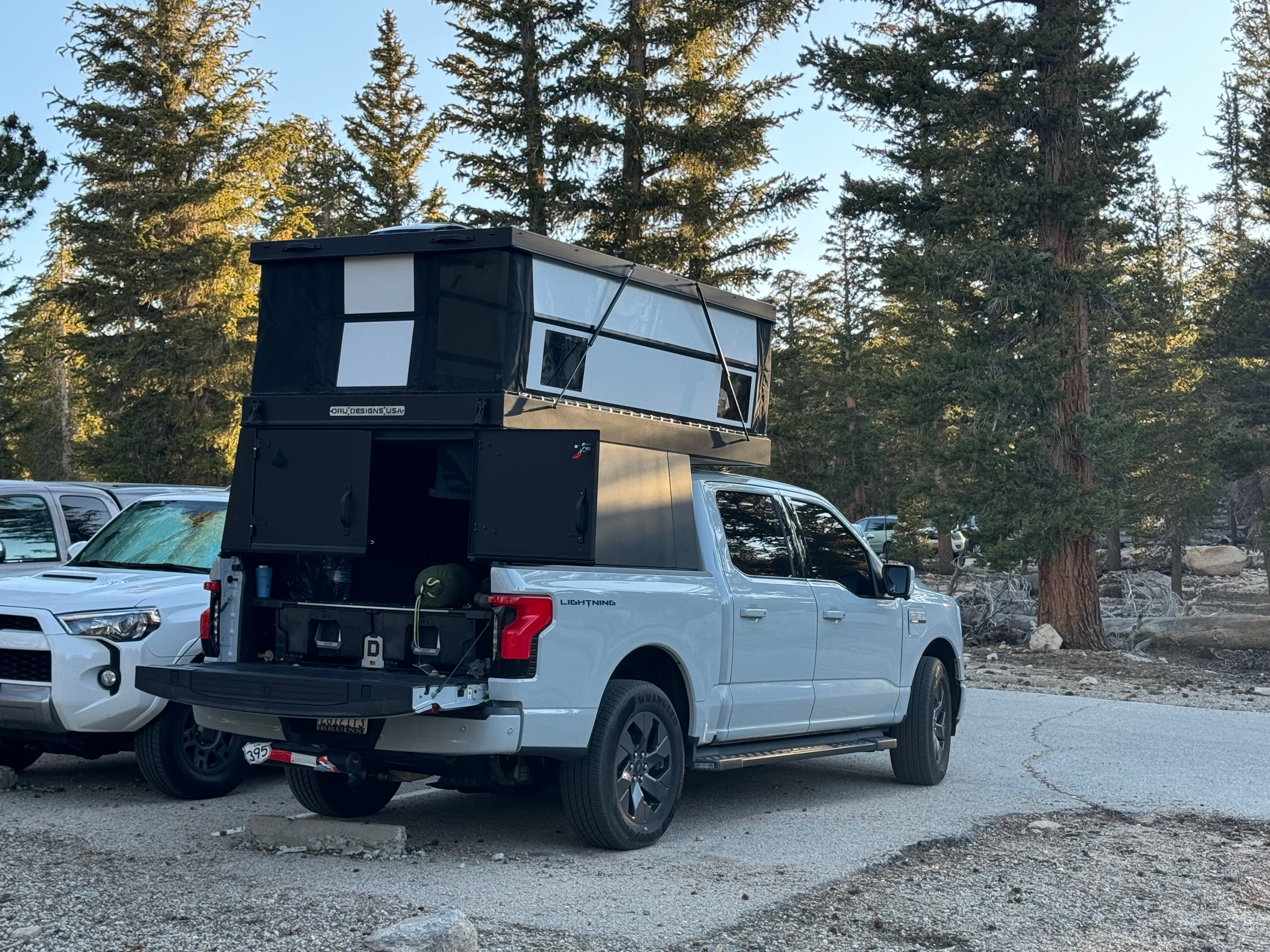 Ali R.'s F-150 Lightning truck with an aftermarket camper accessory.