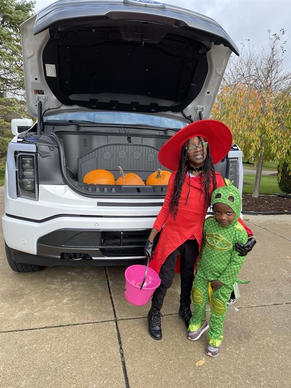 Dapo Adewusi, vehicle engineering manager for both the Mustang Mach-E and the F-150 Lightning, uses the Mega Power Frunk to help with his children's activities.
