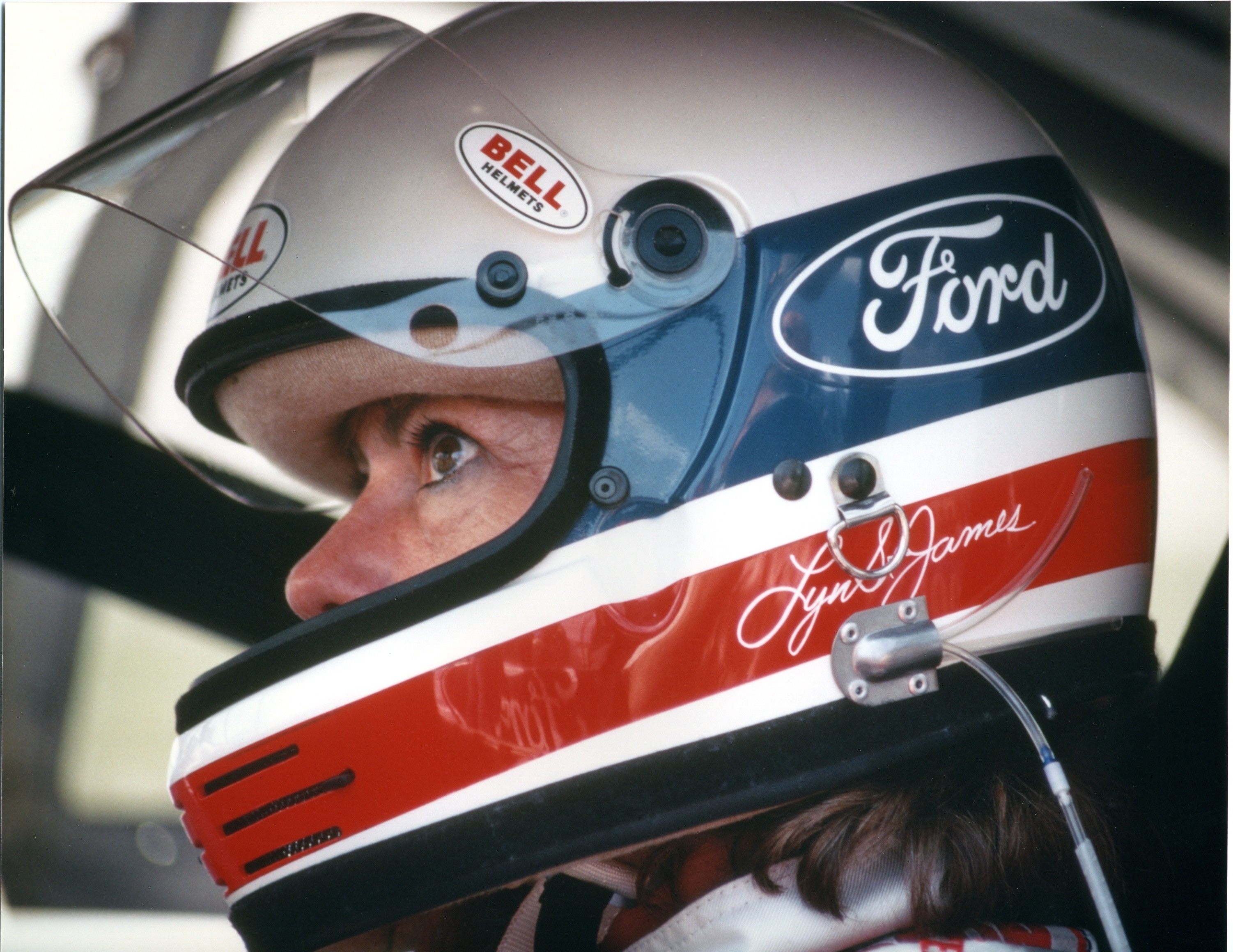 Lyn St. James in a Ford racing helmet.