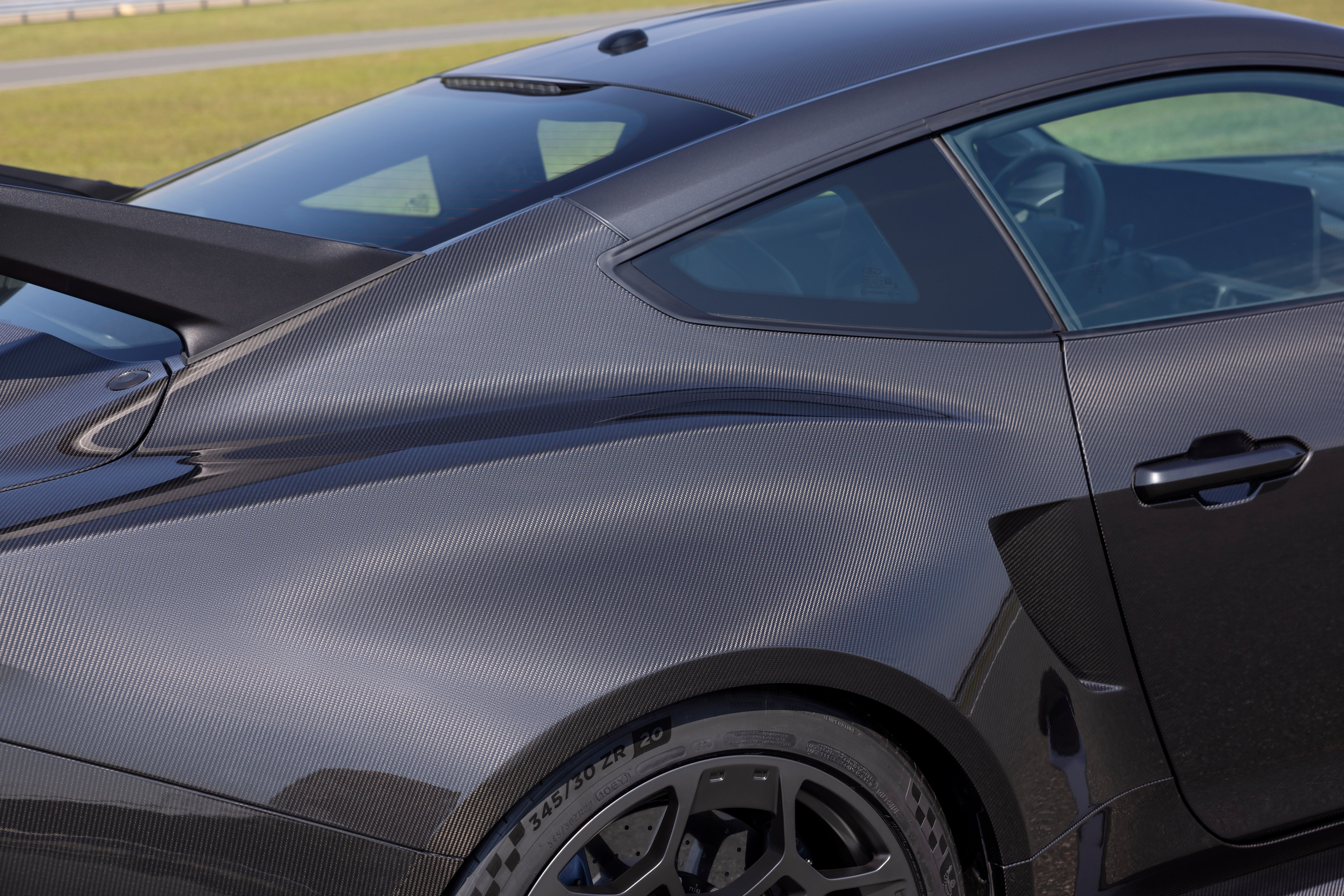 Close-up of the new Mustang Liquid Carbon exterior shows the tiny ridges of the carbon fiber.